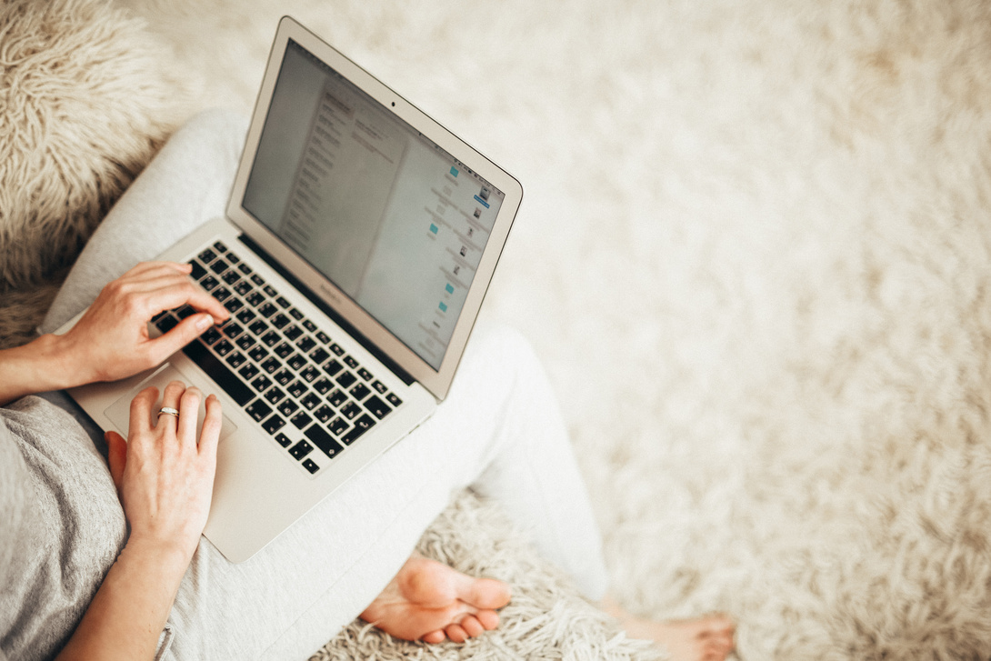 Person Holding Laptop